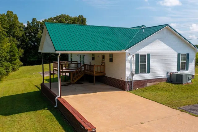 a view of a backyard with a sitting area
