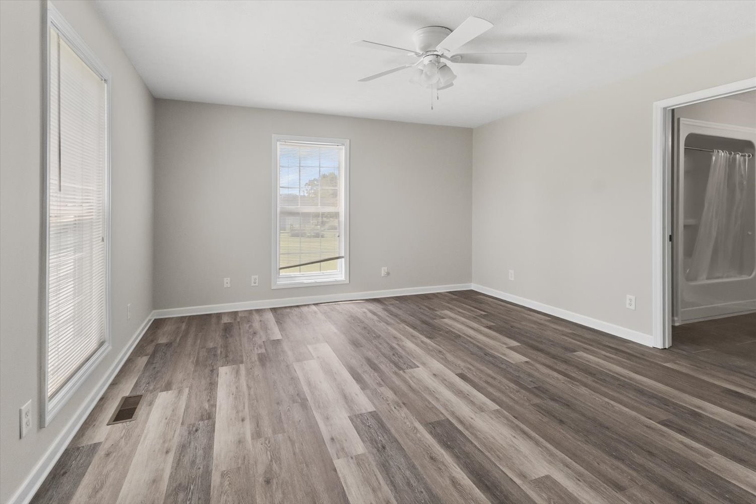 535 Darbytown Road Hohenwald, TN 38462 - Photo 21 of 45 wooden floor in an empty room with a window