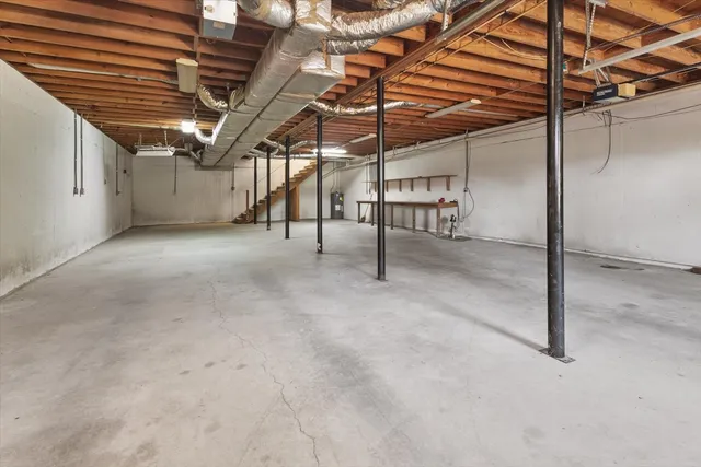 a view of water heater room with wooden ceiling