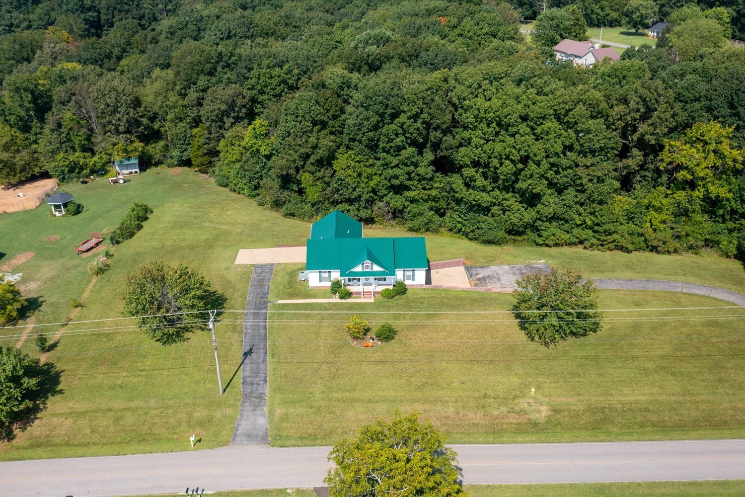 535 Darbytown Road Hohenwald, TN 38462 - Photo 40 of 45 a view of a lake with a yard