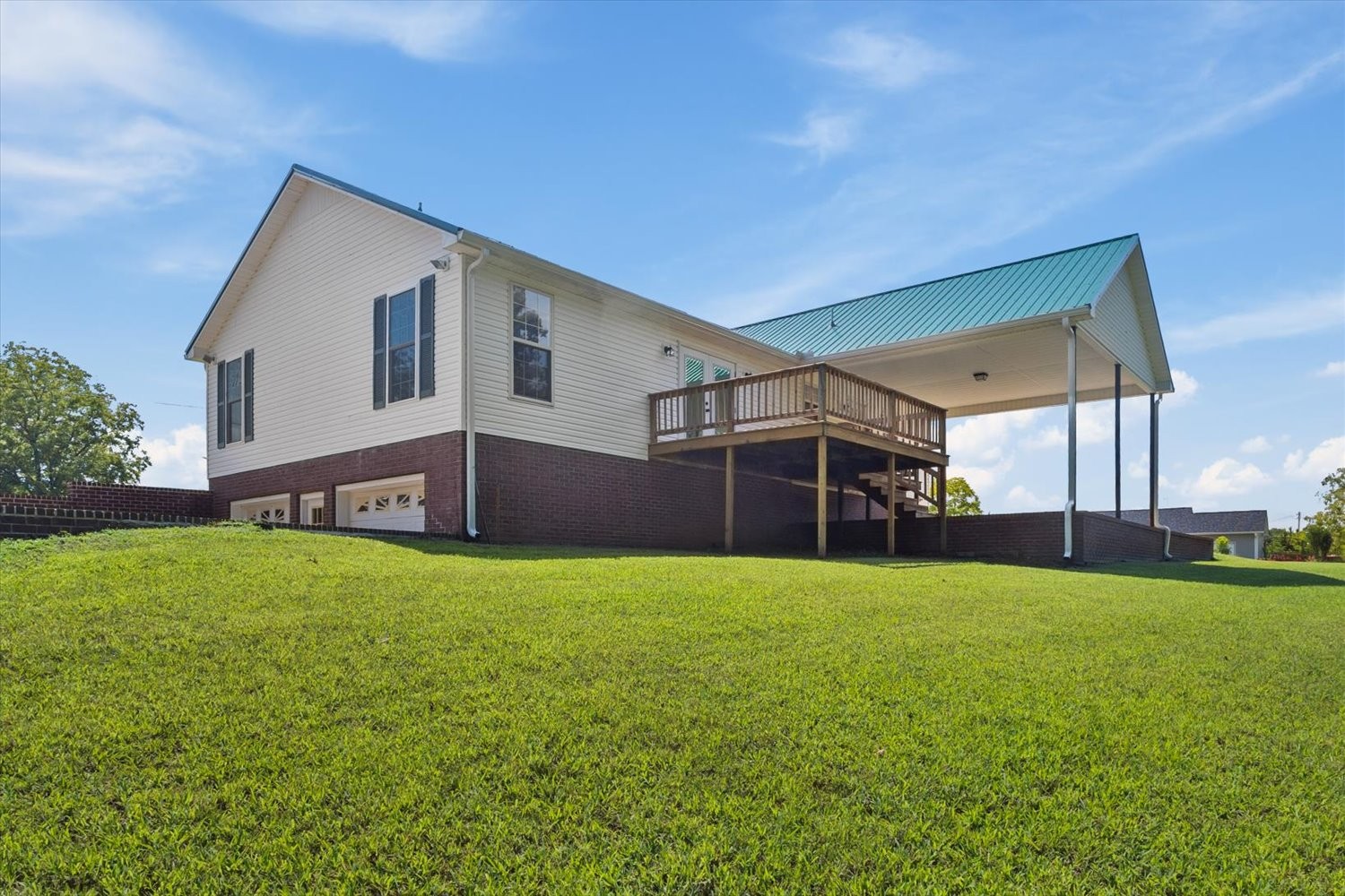 535 Darbytown Road Hohenwald, TN 38462 - Photo 6 of 45 a view of a house with a backyard