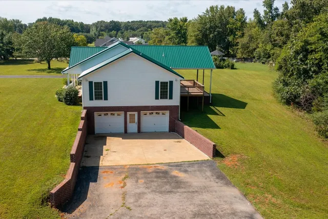a view of house with swimming pool