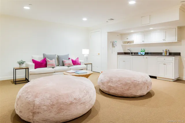 a bed room with a bed and white cabinets