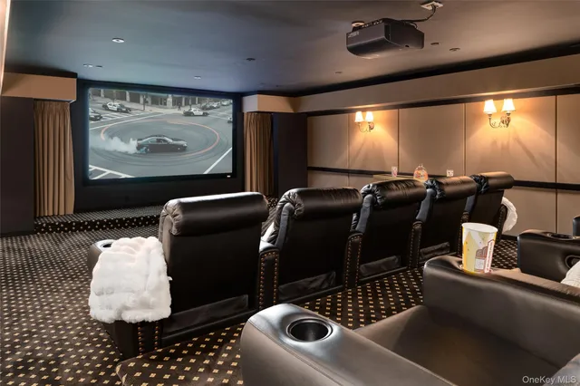 a room with furniture projector and screen