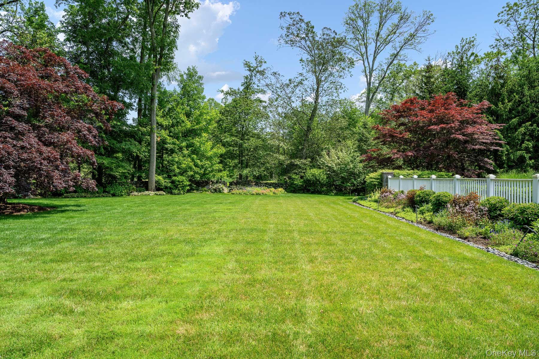 21 Dorann Road Purchase, NY 10577 - Photo 30 of 39 a view of a garden with basketball court