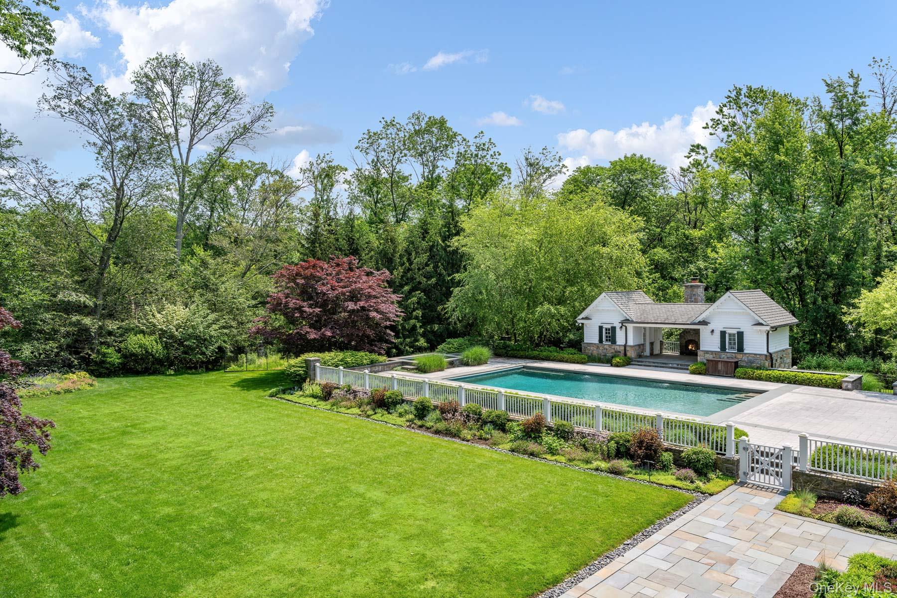 21 Dorann Road Purchase, NY 10577 - Photo 31 of 39 a view of an house with a big yard and large trees