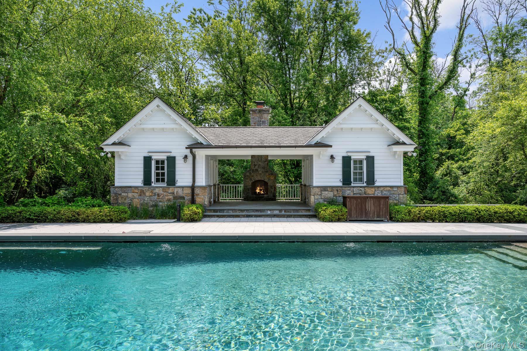 21 Dorann Road Purchase, NY 10577 - Photo 33 of 39 a front view of a house with a yard