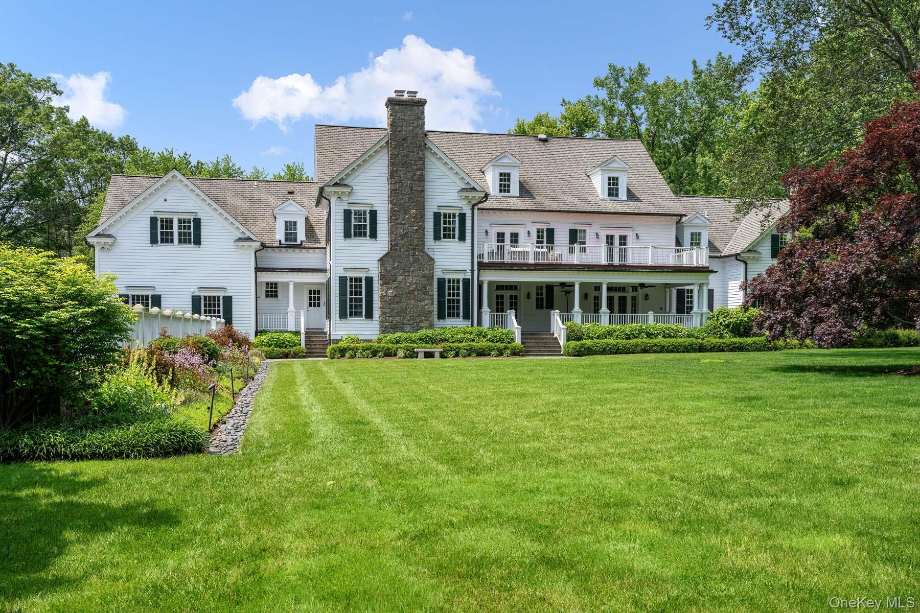 21 Dorann Road Purchase, NY 10577 - Photo 35 of 39 a front view of a house with a garden