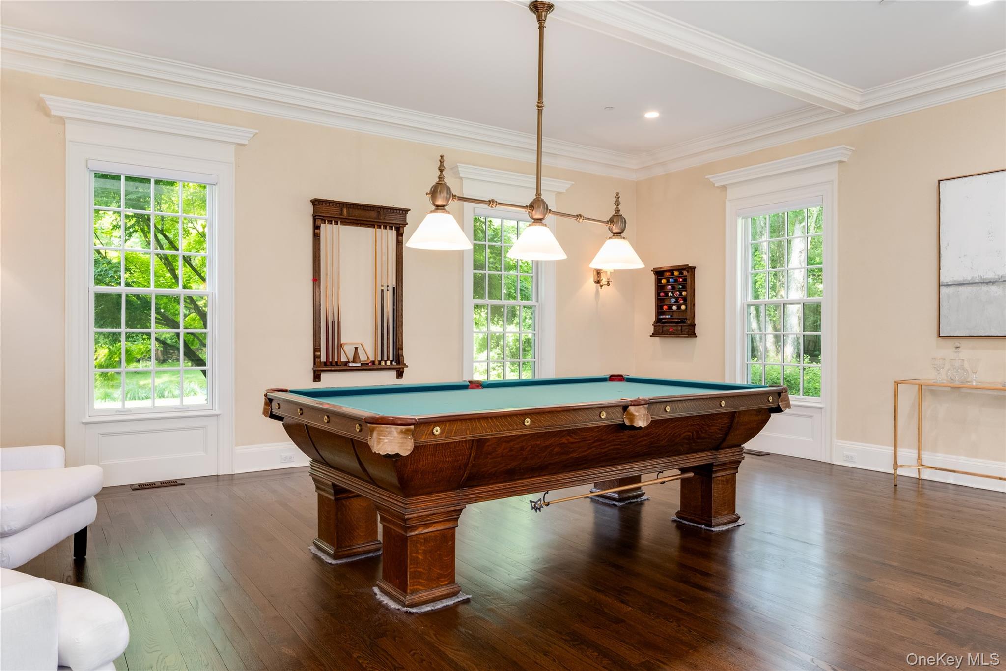 21 Dorann Road Purchase, NY 10577 - Photo 10 of 39 a room with wooden floor pool table and windows
