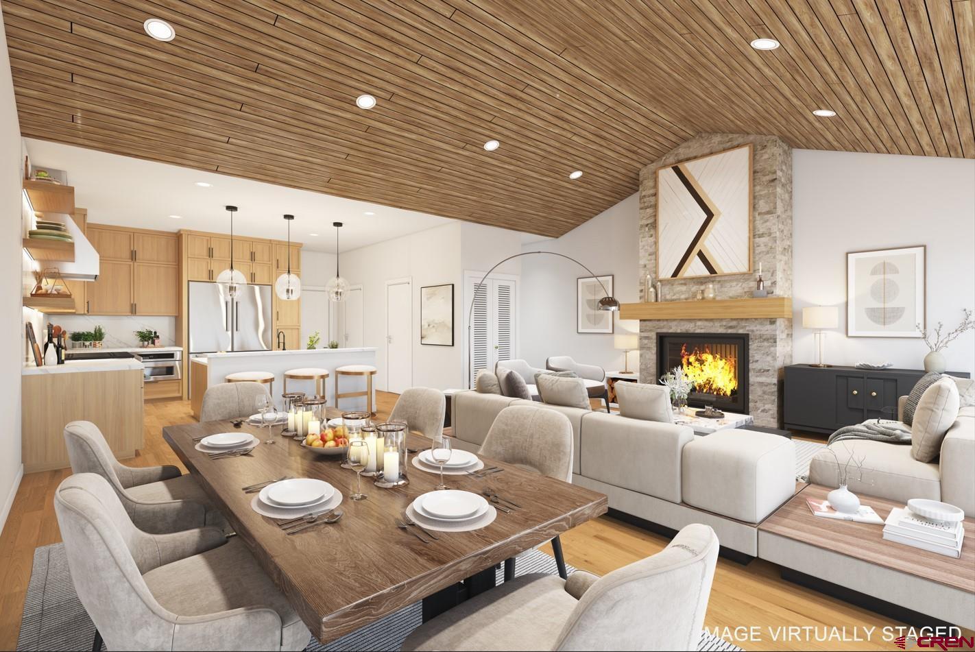 89 Travertine Trail Durango, CO 81301 - Photo 2 of 27 a view of a dining room with furniture a fireplace and wooden floor