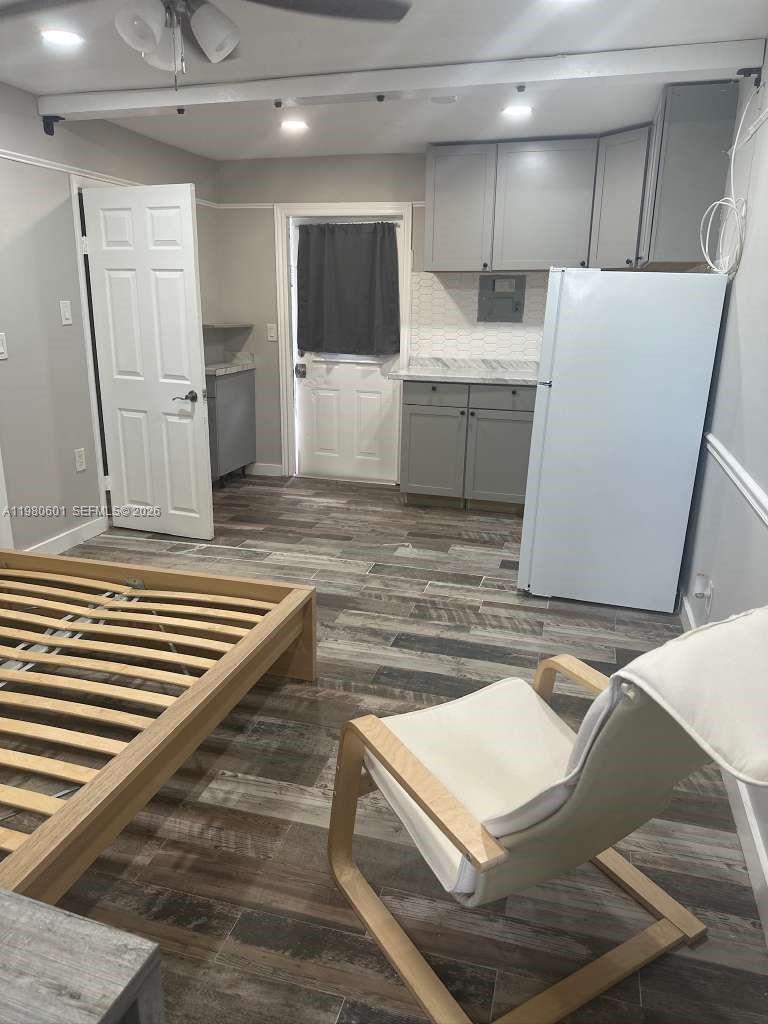 6837 Southwest 39th Terrace, Unit B Miami, FL 33155 - Photo 13 of 16 a view of kitchen and wooden cabinets
