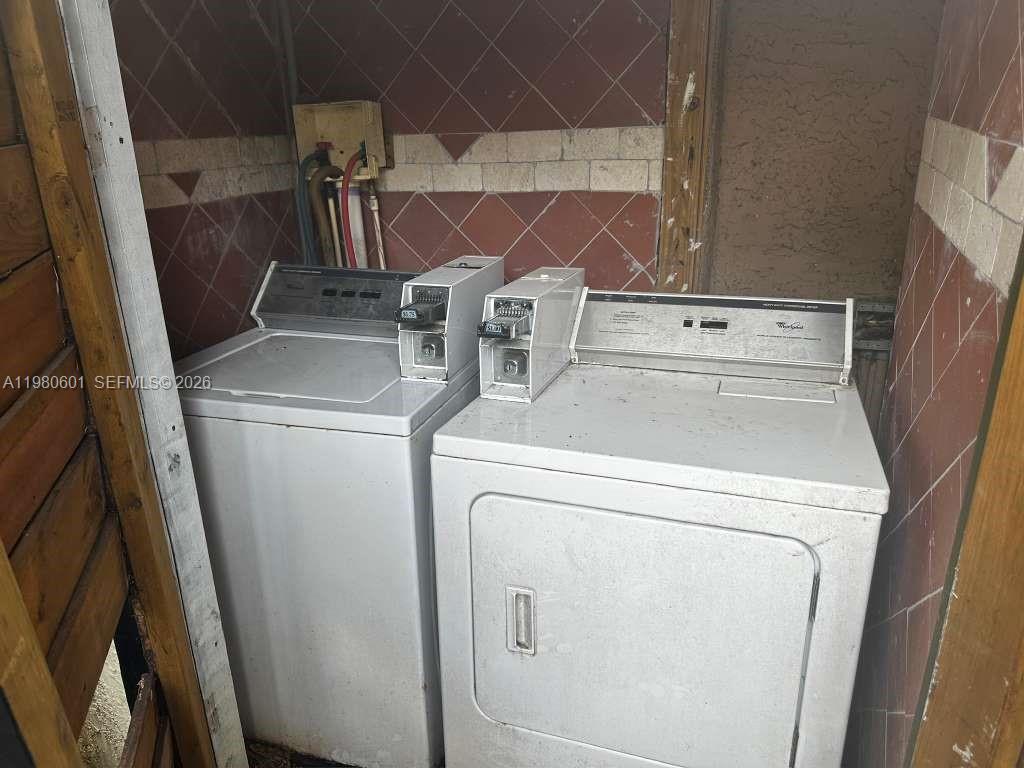 6837 Southwest 39th Terrace, Unit B Miami, FL 33155 - Photo 16 of 16 a utility room with dryer and washer