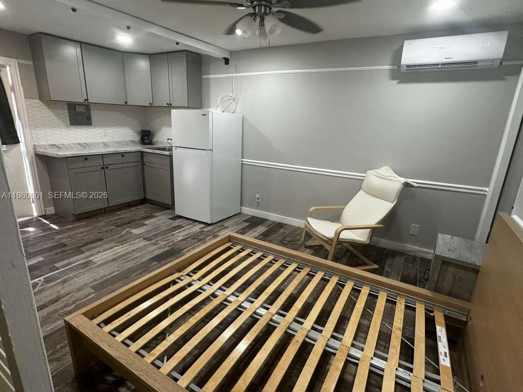 6837 Southwest 39th Terrace, Unit B Miami, FL 33155 - Photo 8 of 16 a kitchen with a sink and refrigerator