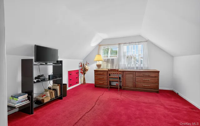 a room with furniture and a flat screen tv