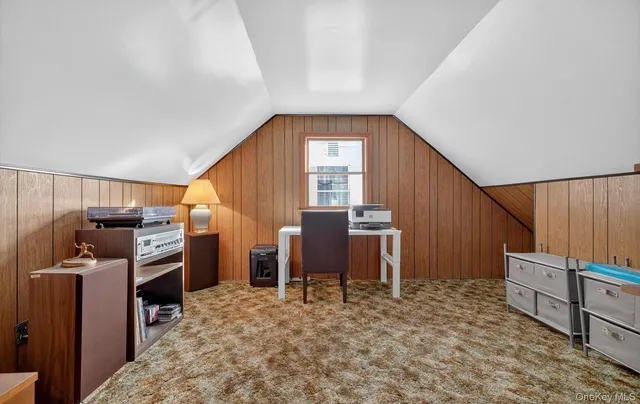 a view of a kitchen with furniture and staircase