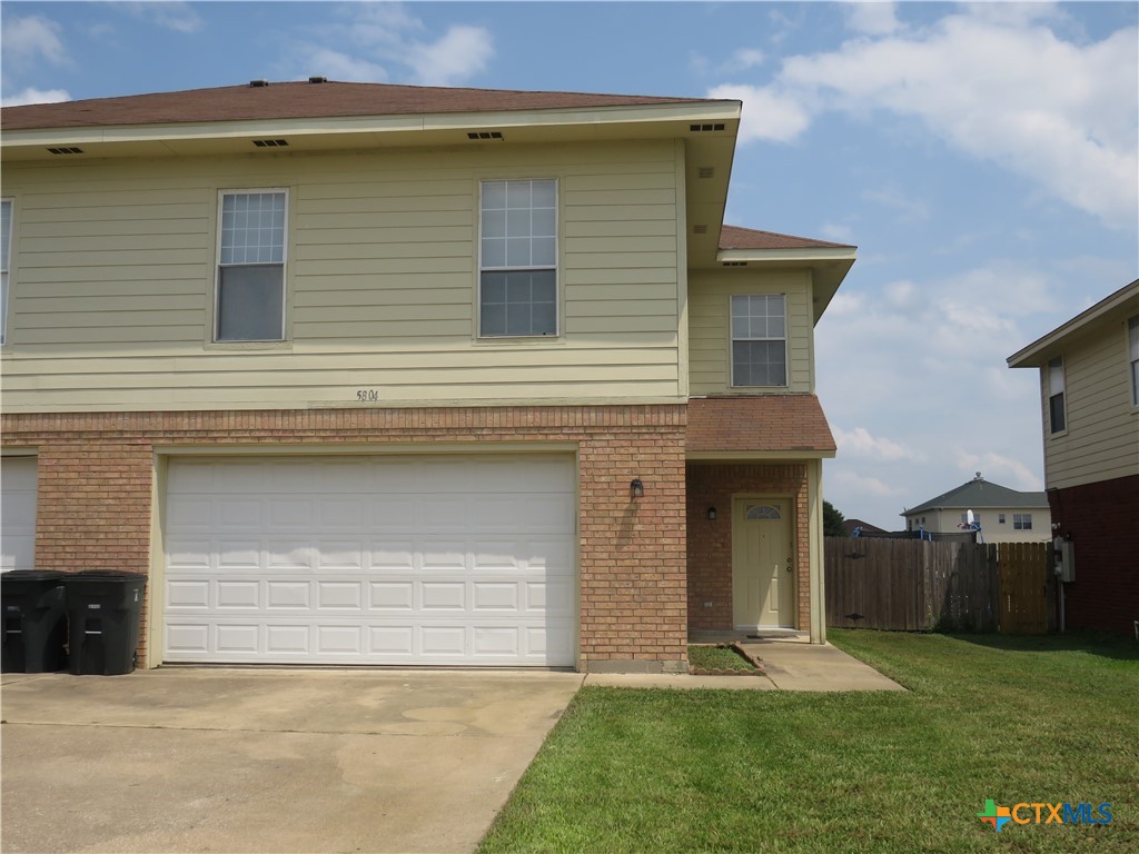 5804 Hamza Circle Killeen, TX 76542 - Photo 1 of 18 a front view of a house with a yard