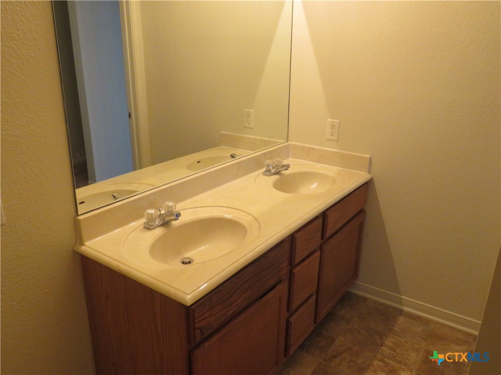 5804 Hamza Circle Killeen, TX 76542 - Photo 11 of 18 a bathroom with a sink and a mirror