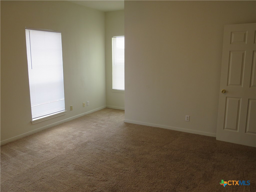5804 Hamza Circle Killeen, TX 76542 - Photo 13 of 18 an empty room with windows