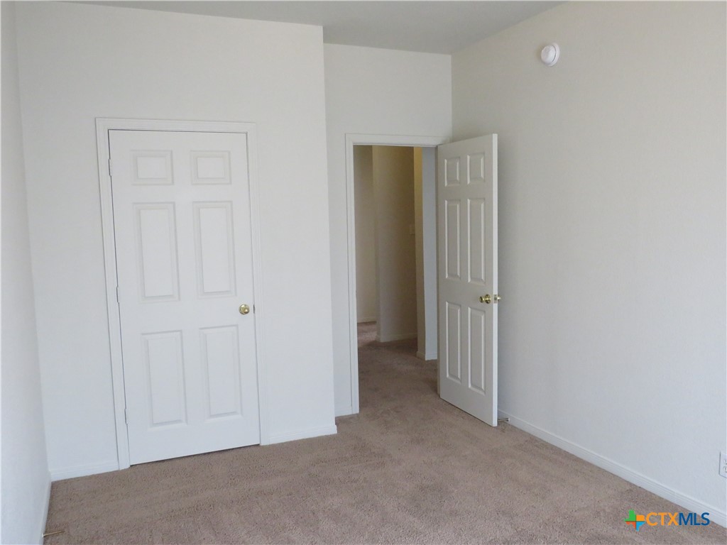 5804 Hamza Circle Killeen, TX 76542 - Photo 16 of 18 a view of an empty room with closet area