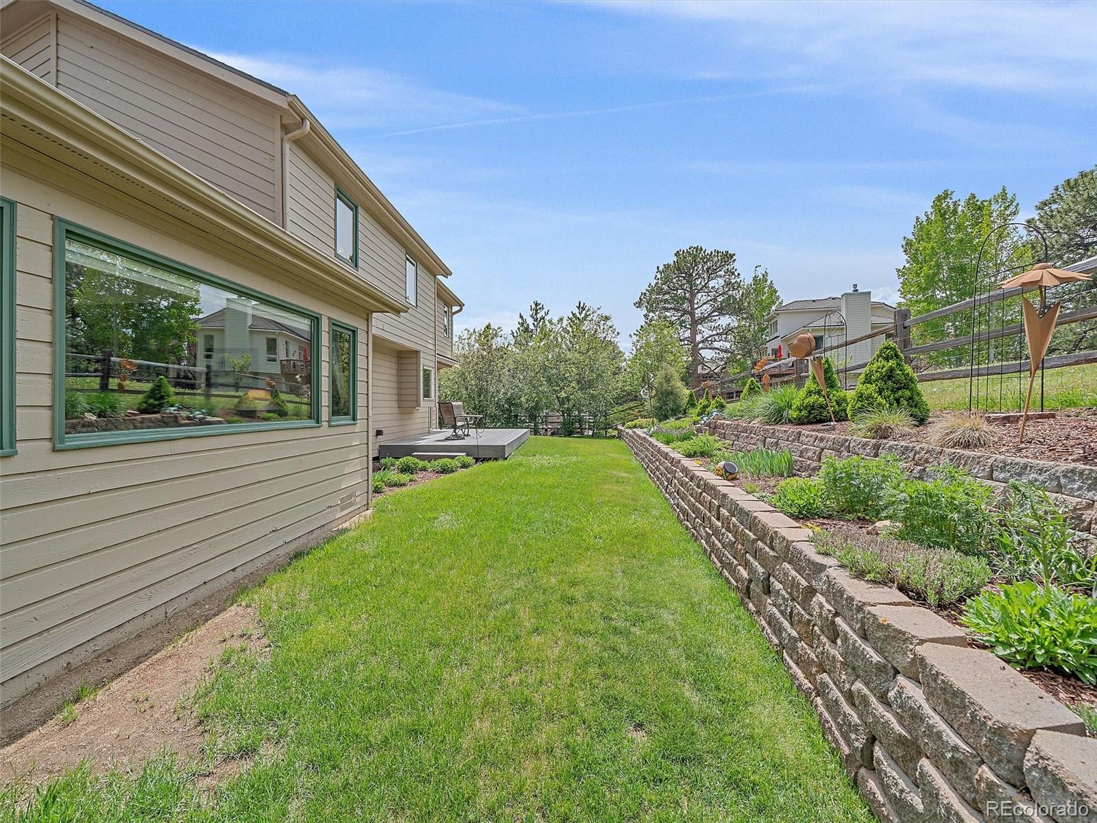 31412 North Bermuda Dunes Drive Evergreen, CO 80439 - Photo 36 of 46 a view of a house with a yard