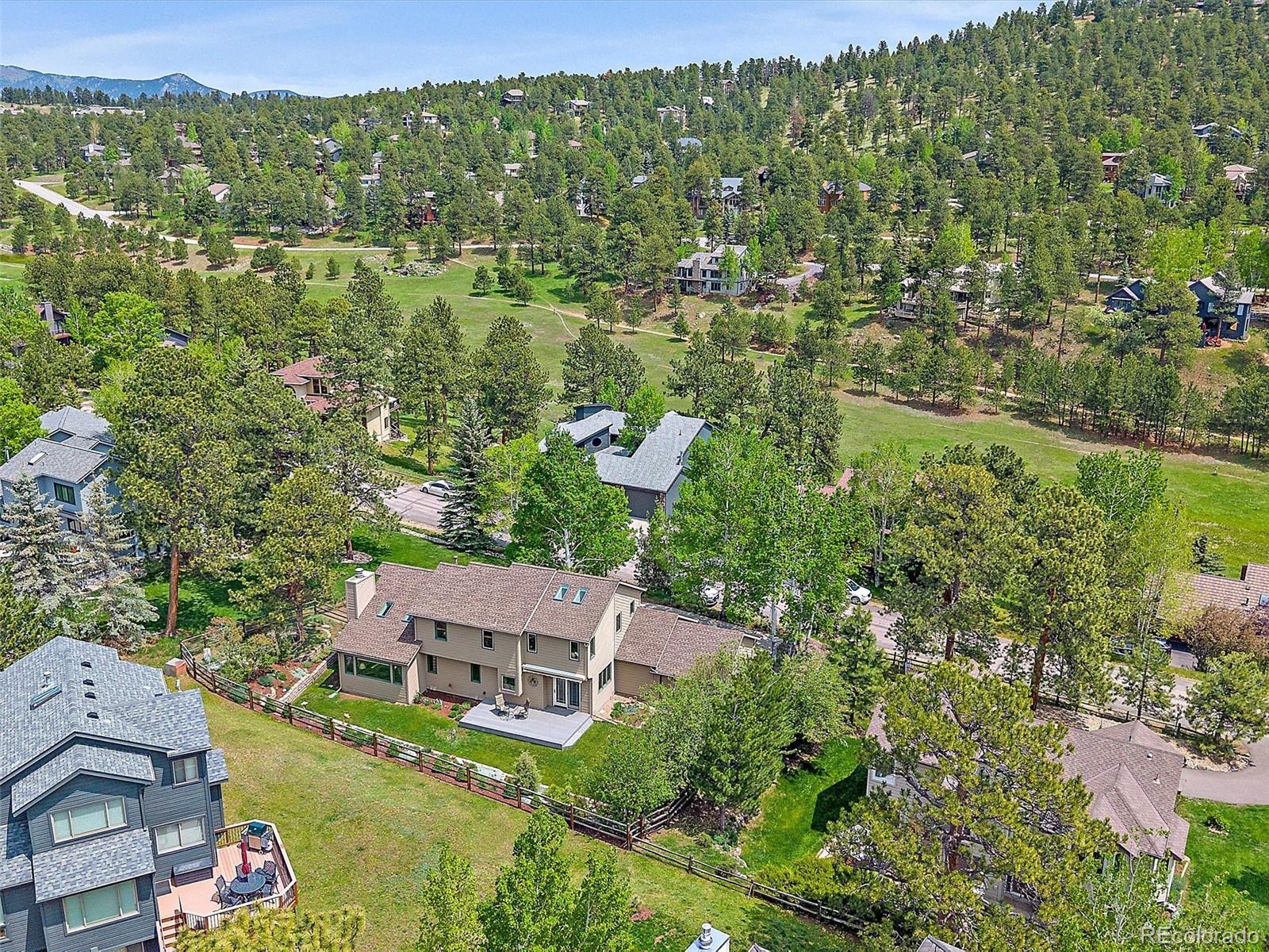 31412 North Bermuda Dunes Drive Evergreen, CO 80439 - Photo 40 of 46 an aerial view of residential houses with outdoor space and trees