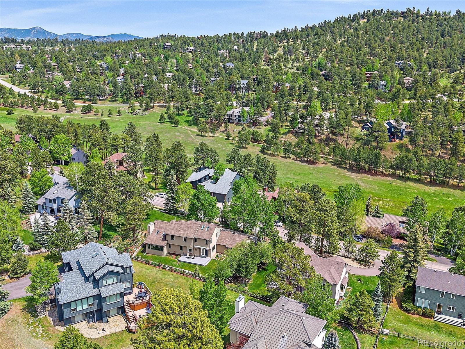 31412 North Bermuda Dunes Drive Evergreen, CO 80439 - Photo 41 of 46 an aerial view of residential houses with outdoor space and trees