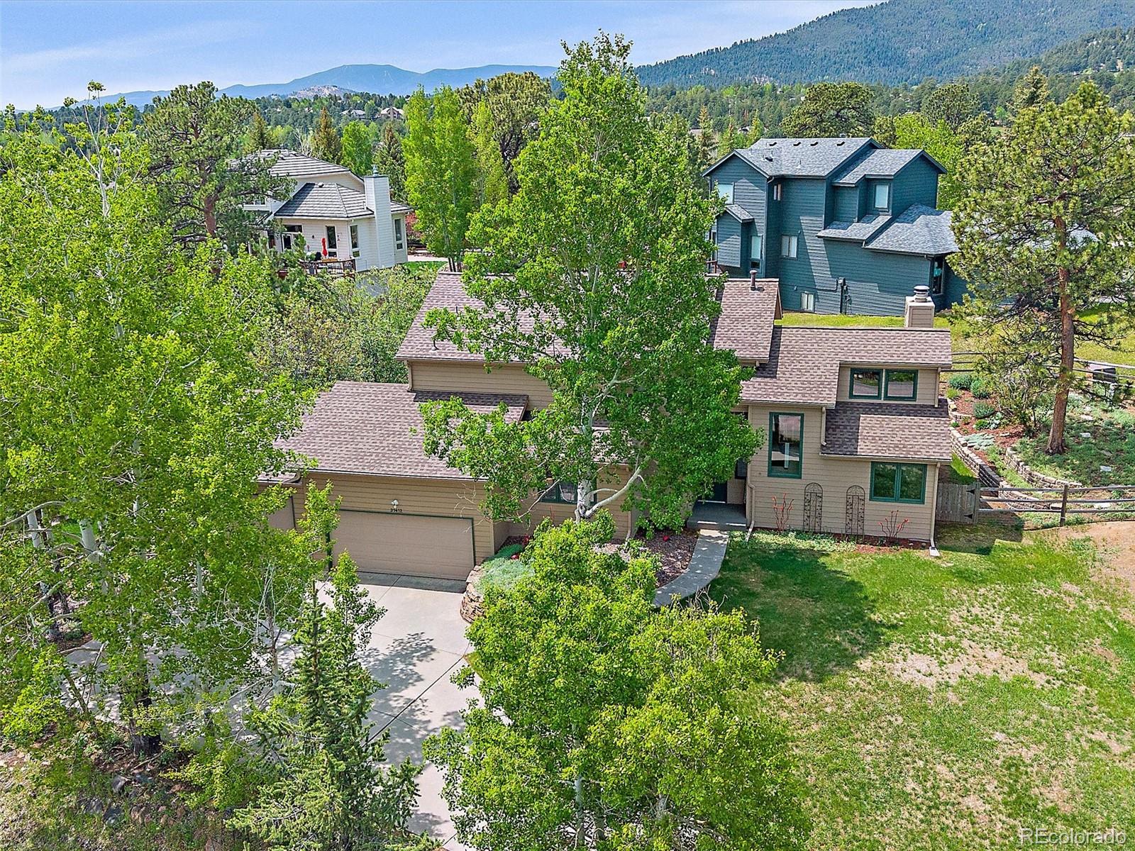 31412 North Bermuda Dunes Drive Evergreen, CO 80439 - Photo 43 of 46 an aerial view of a house with a garden