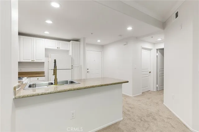 a view of a kitchen with a sink