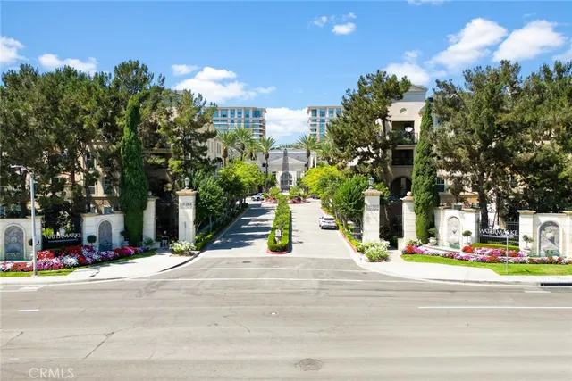 a view of house with yard and sitting area
