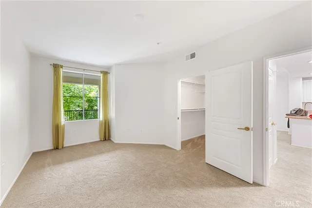 a view of an empty room and window