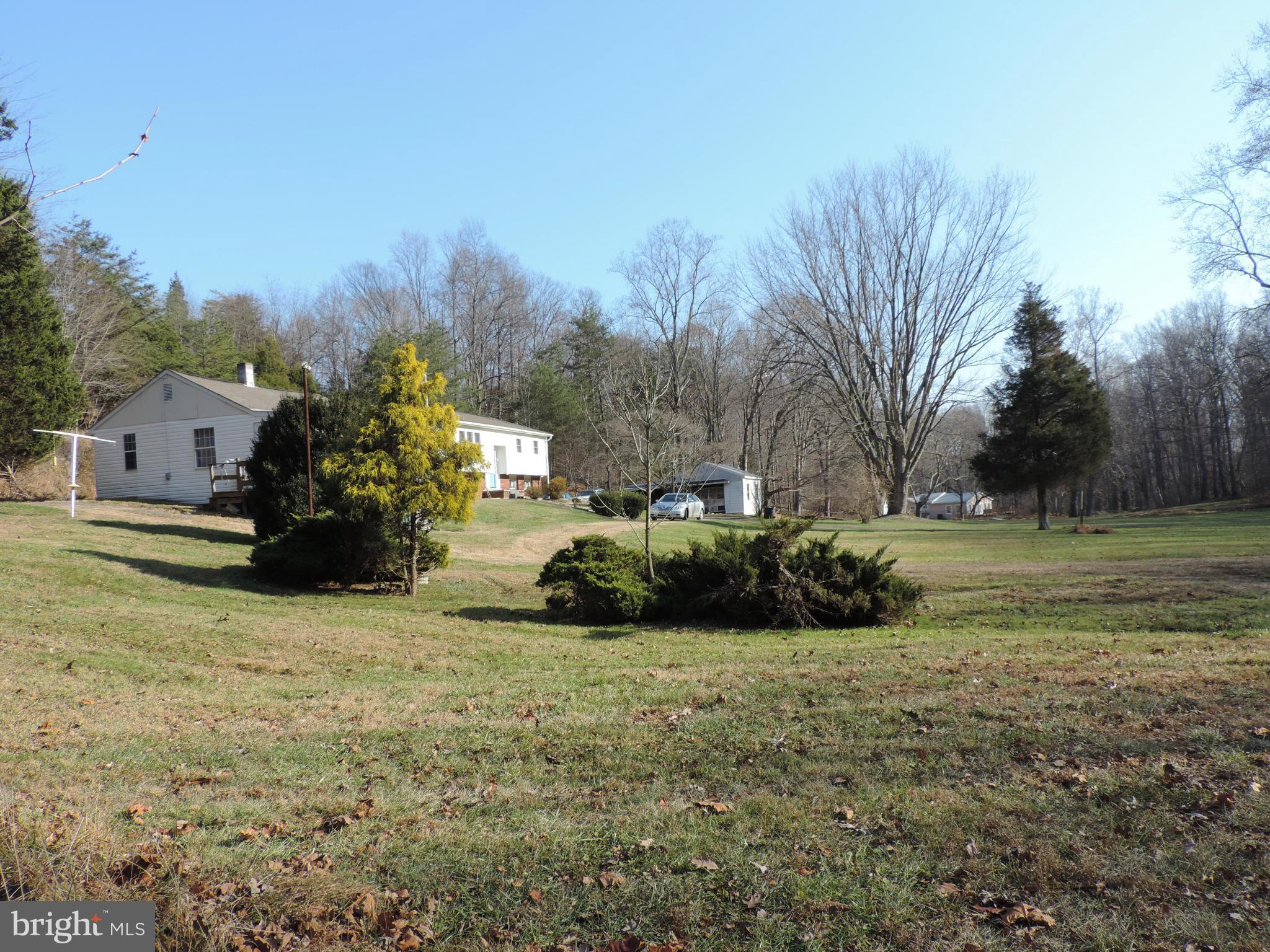 9215 Hawkins Creamery Road Gaithersburg, MD 20882 - Photo 15 of 23 a view of a house with a big yard