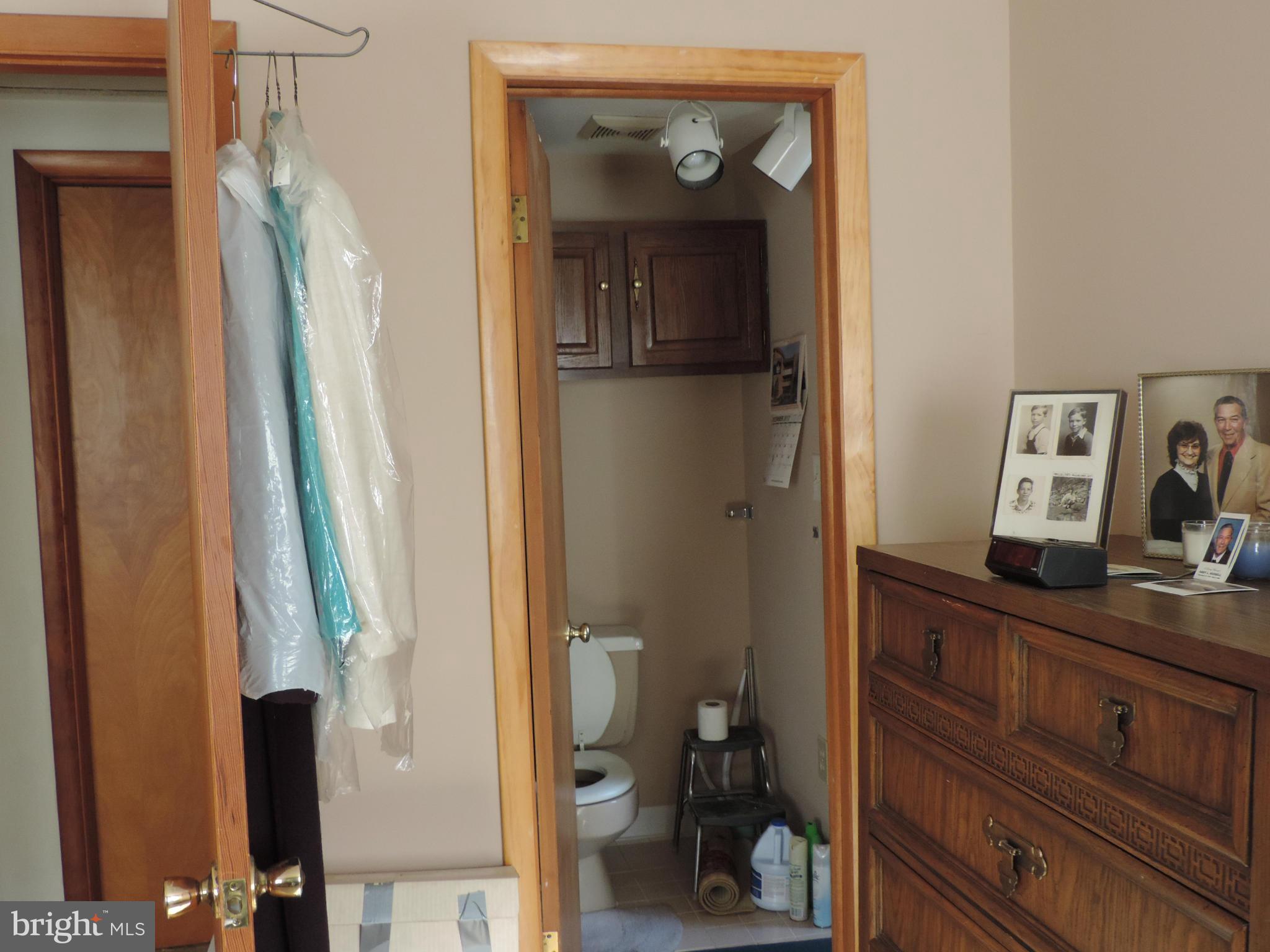 9215 Hawkins Creamery Road Gaithersburg, MD 20882 - Photo 19 of 23 a view of a hallway with closet and a mirror