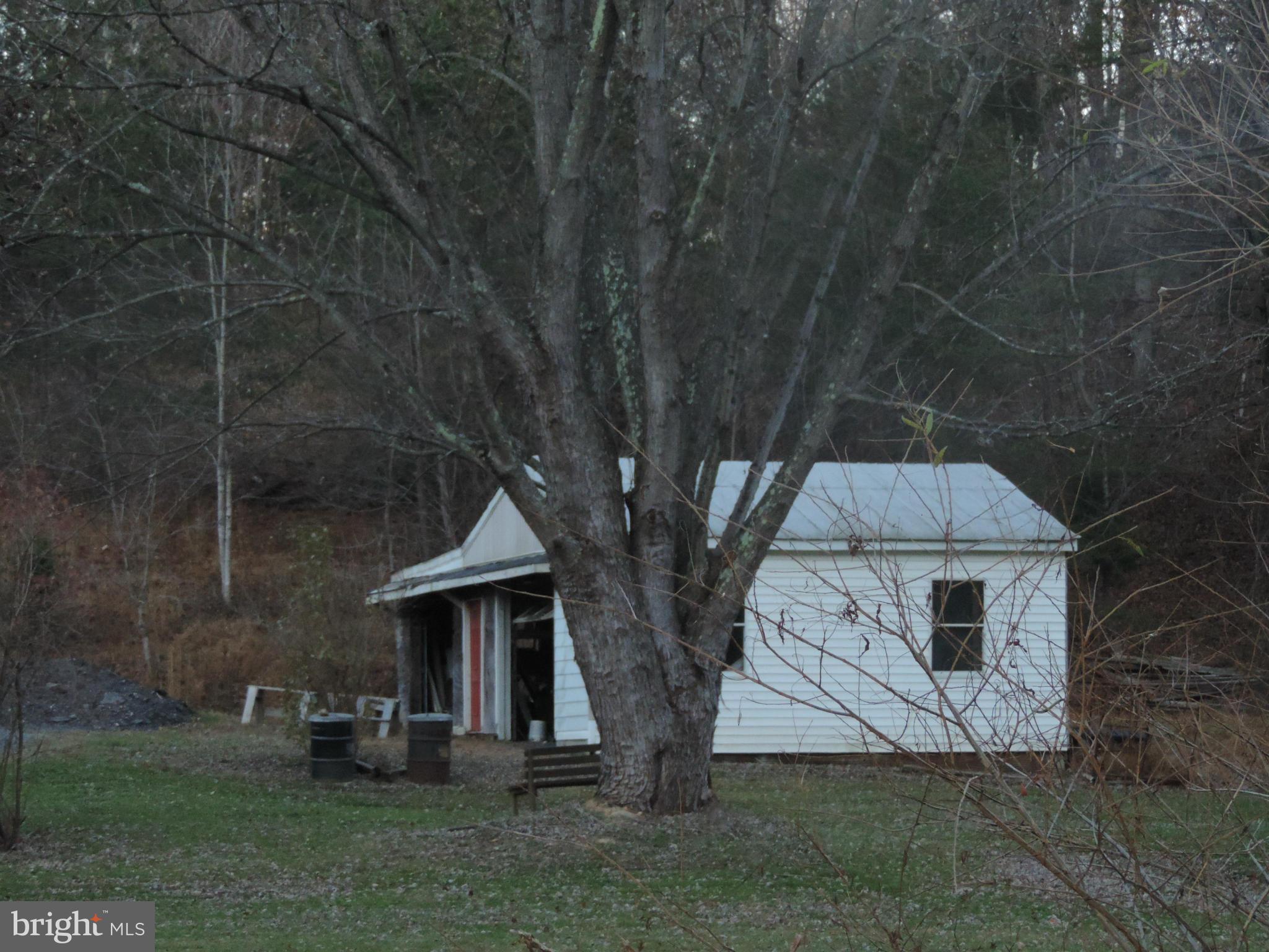 9215 Hawkins Creamery Road Gaithersburg, MD 20882 - Photo 23 of 23 a house with trees in front of it