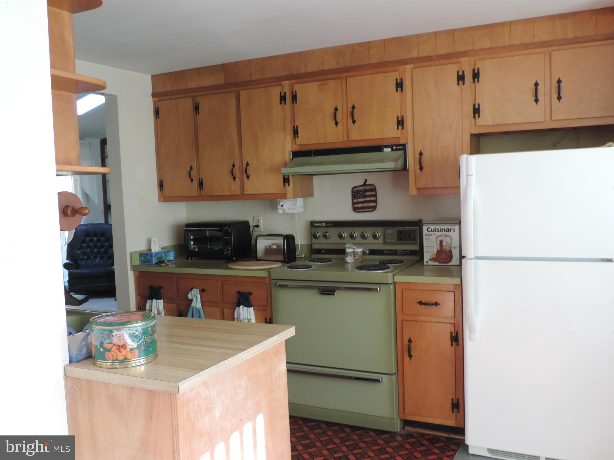 9215 Hawkins Creamery Road Gaithersburg, MD 20882 - Photo 6 of 23 a kitchen with stainless steel appliances granite countertop a refrigerator sink and cabinets
