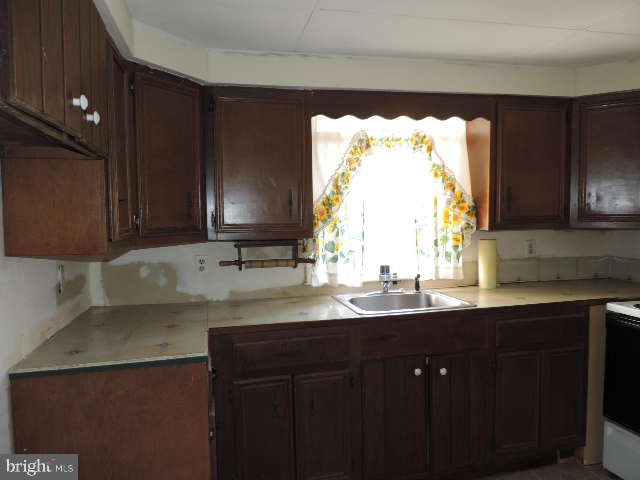 9215 Hawkins Creamery Road Gaithersburg, MD 20882 - Photo 8 of 23 a kitchen with a sink and a window