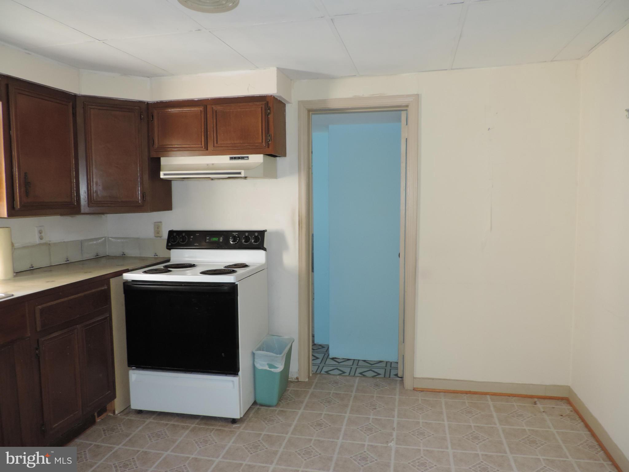 9215 Hawkins Creamery Road Gaithersburg, MD 20882 - Photo 9 of 23 a stove top oven sitting inside of a kitchen