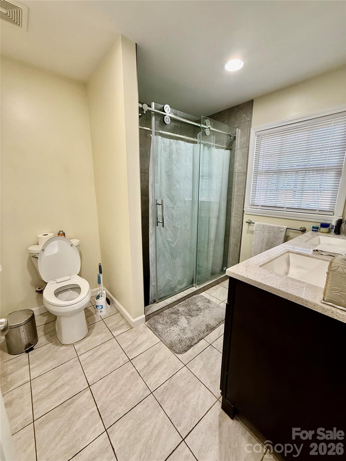 108 Scott Street Morganton, NC 28655 - Photo 12 of 21 a bathroom with a sink toilet and shower