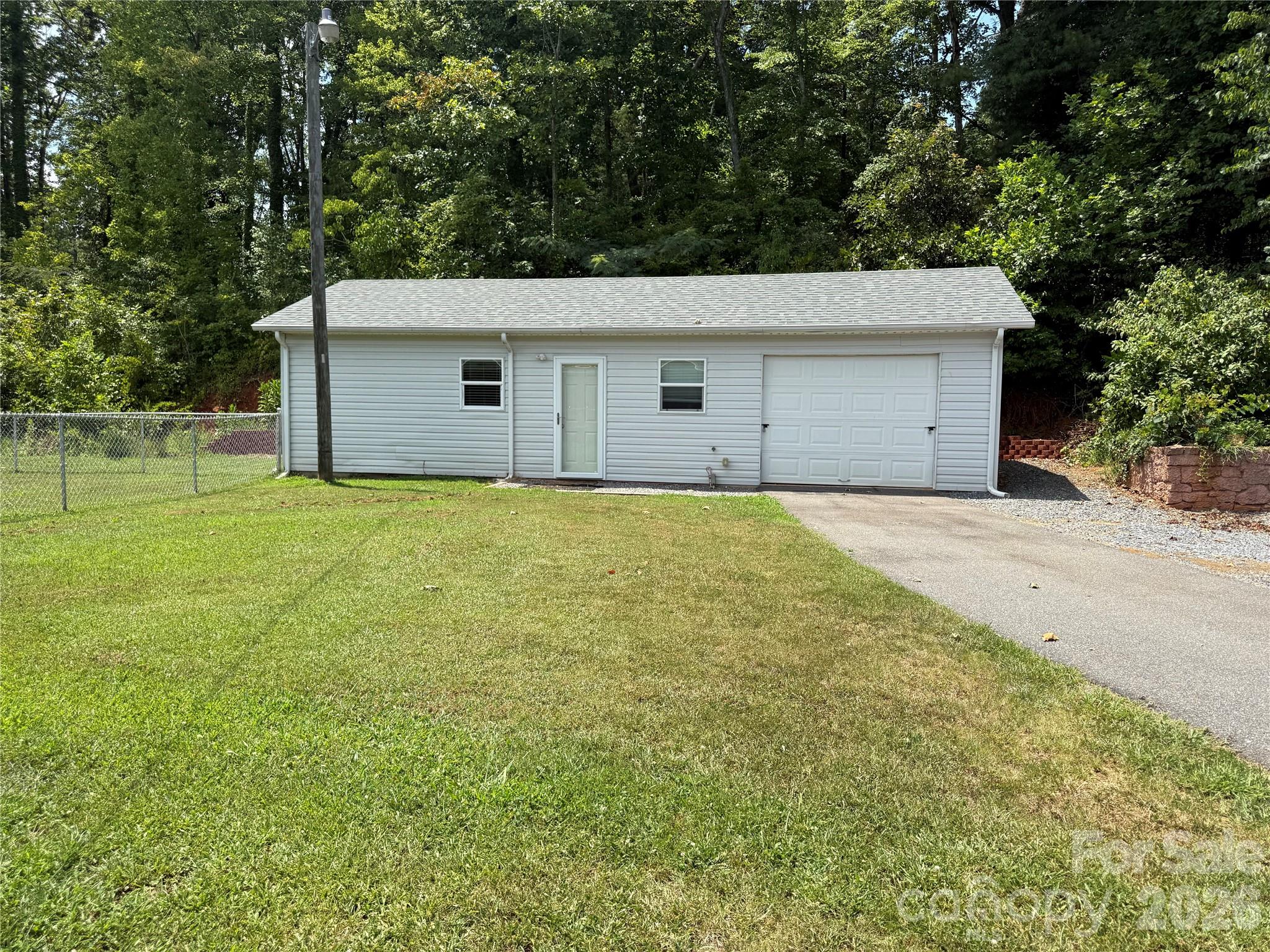 108 Scott Street Morganton, NC 28655 - Photo 17 of 21 a view of a house with a yard
