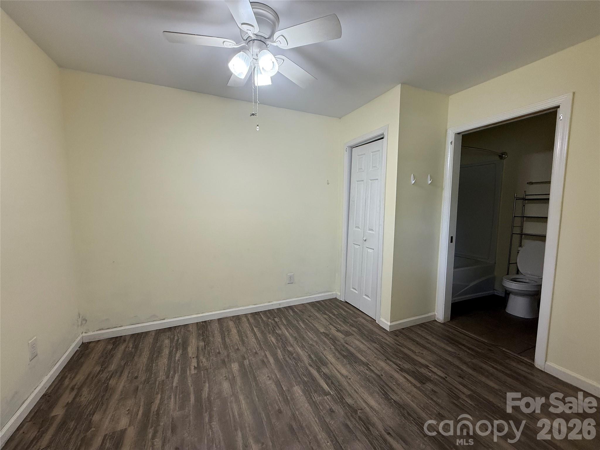 108 Scott Street Morganton, NC 28655 - Photo 18 of 21 wooden floor in an empty room with a bathroom