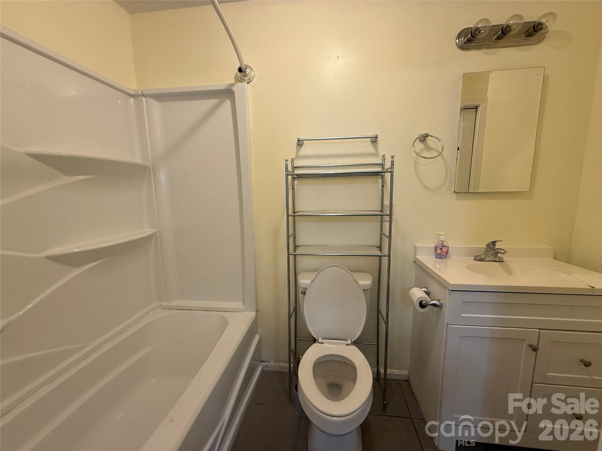 108 Scott Street Morganton, NC 28655 - Photo 20 of 21 a bathroom with a sink a toilet and shower