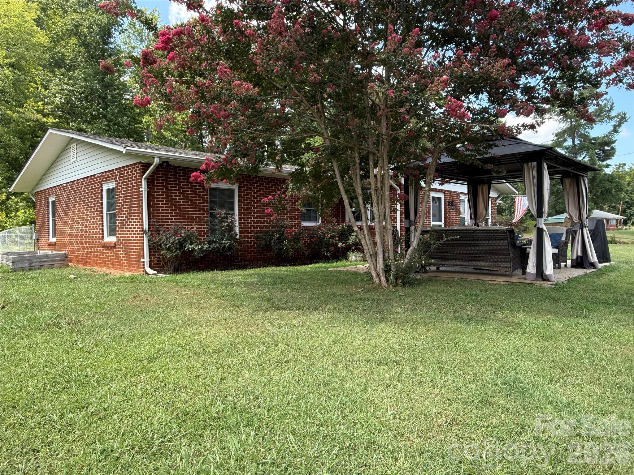 108 Scott Street Morganton, NC 28655 - Photo 2 of 21 a front view of house with yard and green space
