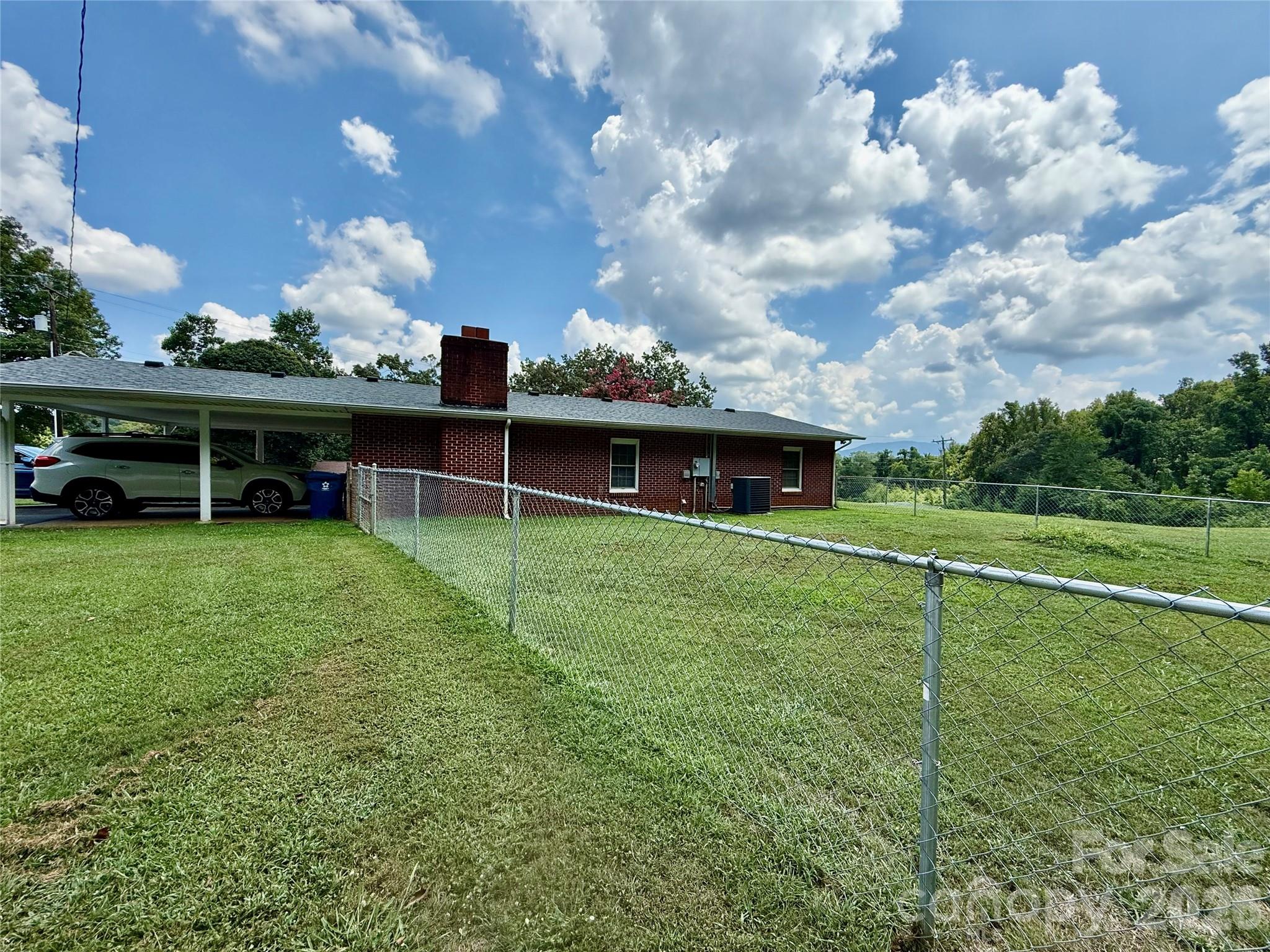 108 Scott Street Morganton, NC 28655 - Photo 3 of 21 a view of a house with a yard