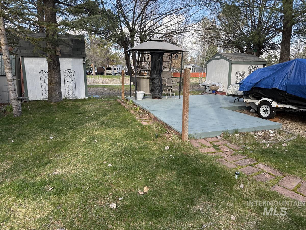 7 H Street Cascade, ID 83611 - Photo 4 of 14 Grassy Area with Sprinkler System