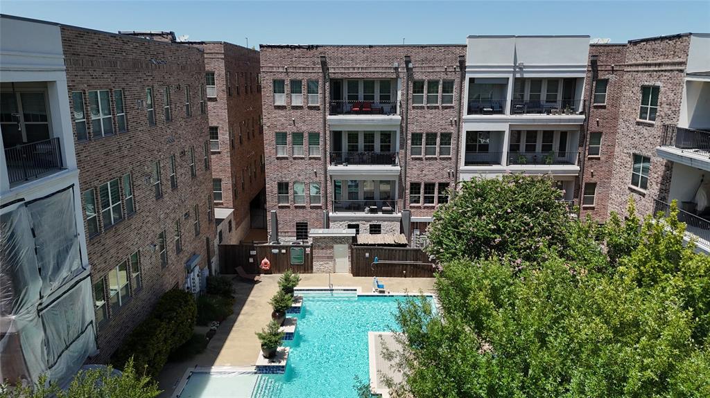 5015 Meridian Lane, Unit 2102 Addison, TX 75001 - Photo 30 of 36 Central swimming pool with a surrounding hardscape patio