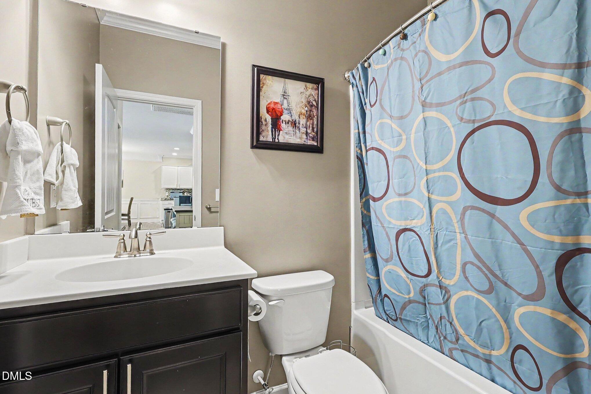 4366 Auburn Hills Drive Raleigh, NC 27616 - Photo 29 of 40 a bathroom with a toilet and a sink