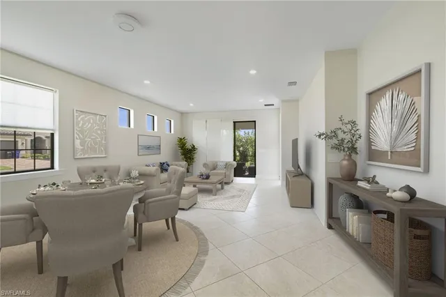 a living room with furniture a large window and a table