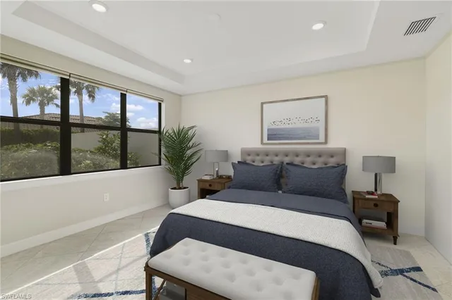 a bedroom with a large bed and a window