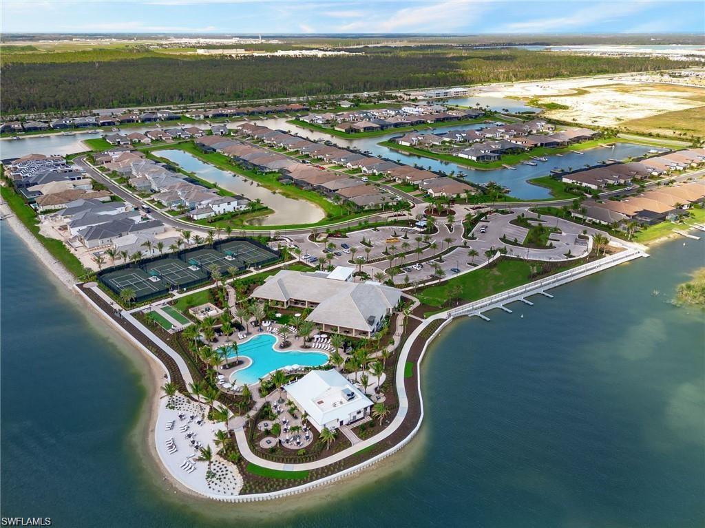 17301 Via Corsini Way Fort Myers, FL 33913 - Photo 9 of 17 a view of a swimming pool with an ocean view