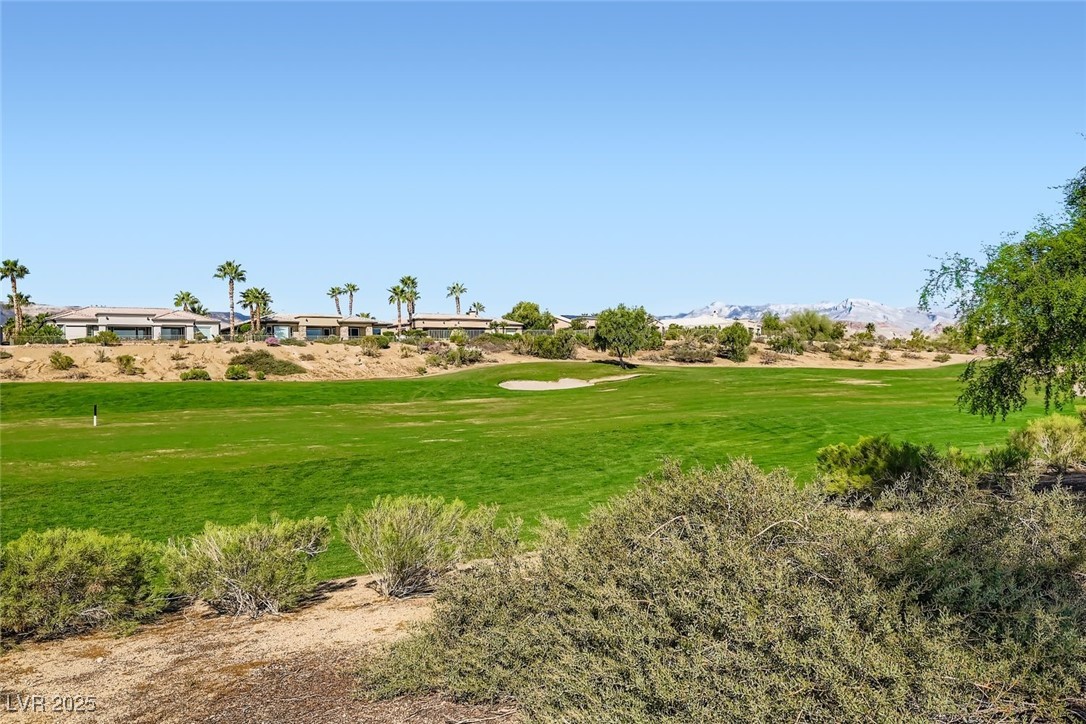 5015 Rivedro Street Las Vegas, NV 89135 - Photo 31 of 63 From the back of the property, enjoy a sweeping vista of the 15th fairway at Siena Golf Club—where manicured greens meet the dramatic backdrop of the Sierra Nevada Mountains. A truly breathtaking view that elevates everyday living into a resort-like experience.