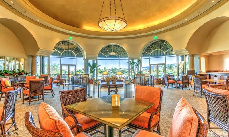 5015 Rivedro Street Las Vegas, NV 89135 - Photo 35 of 63 "The magnificent Rotunda, centrally located in the Community Center, offers stunning views of Lake Siena. This versatile space serves as a hub for social gatherings, fostering community connections, and is a favorite spot for lively card games and other Community Events."